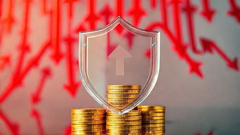 A photorealistic image of a clear glass shield protecting a stack of gold coins and paper money from a torrent of red arrows pointing downwards, symbolizing tax-efficient strategies preserving wealth during a market decline. Professional photography, 8K, cinematic lighting, sharp focus on the shield and money, depth of field blurring the arrows, shot on a high-end DSLR.