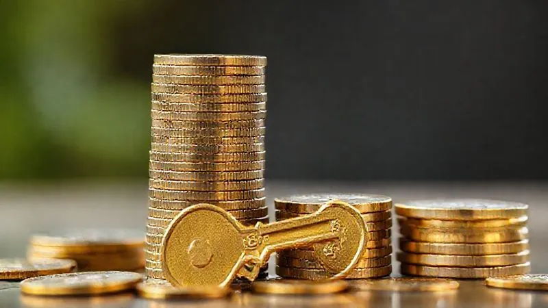 A photorealistic representation of a financial strategy where a stack of coins grows taller, metaphorically representing increasing equity and investment properties, with a HELOC key acting as a foundation. The scene is clean, professional, and highlights growth and stability. Professional photography, 8K, cinematic lighting, sharp focus, depth of field, shot on a high-end DSLR.